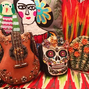 Embroidered pillows and hand-beaded purses