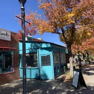 a blue building and a street light