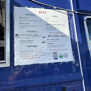 a menu on the side of a food truck