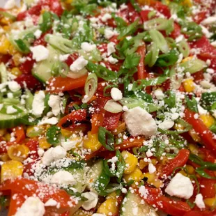 Summer Harvest Salad.  Sweet corn, roasted red peppers and cucumbers make up this salad, for a refreshing summer special.