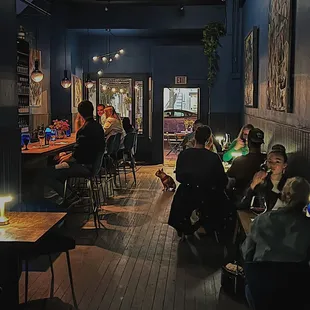a group of people sitting at a bar