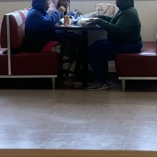 A beautiful family enjoying some delicious Gusherburger meals. Come and have a seat with your family.