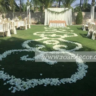 A rose petal aisle design made from natural roses for a wedding in Bakersfield, CA. 
www.roandecor.com
