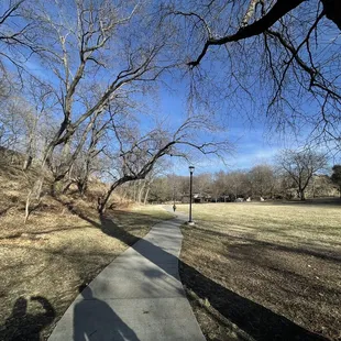 Path that connects first playground to community center-- and brick road to next playground