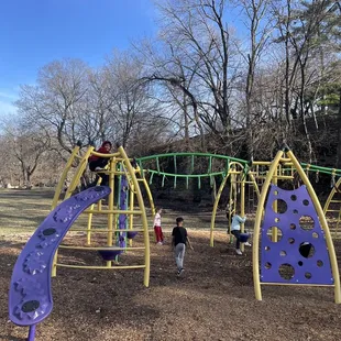 First playground that you get to from top of the hill and long curvy sidewalk down.