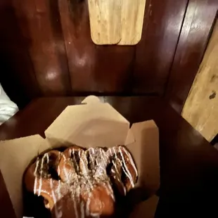 a donut in a box on a table