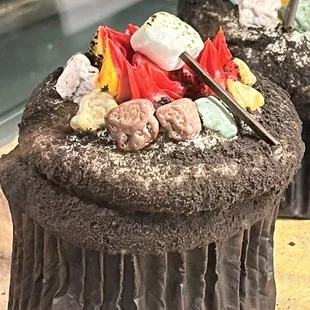 a chocolate cupcake with marshmallows and marshmallows