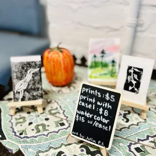 a table with a small chalkboard sign