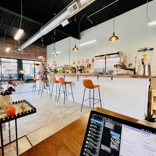 a laptop on a table in a coffee shop