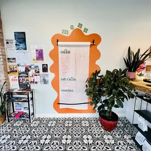 a large poster on the wall of a coffee shop