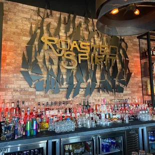 a bar with bottles of alcohol