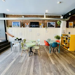 a dining area with tables and chairs
