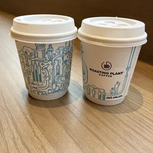 two coffee cups on a table