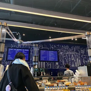 a woman standing in front of a counter