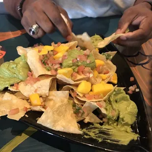 Guacamole Nachos with mangos and pica de gallo yummy!!!