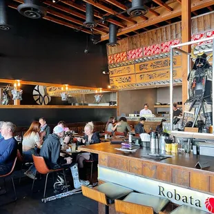 customers sitting at the bar