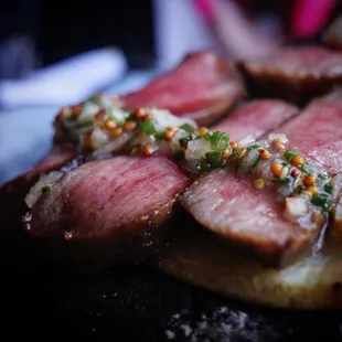 a close - up of a steak on a cutting board