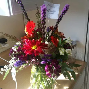 Someone needs to take a flower arranging/art 101 class - red &amp; purple flowers NOT ATTRACTIVE - is this a fall bouquet??