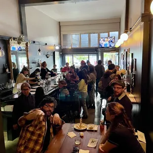 a crowd of people at a bar