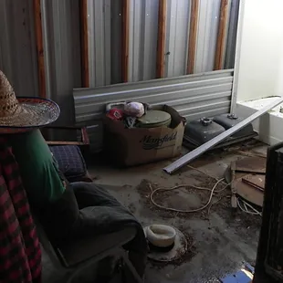 Another room behind the sheriff&apos;s office with a headless somberero-wearing dummy and an olive green toilet in a box