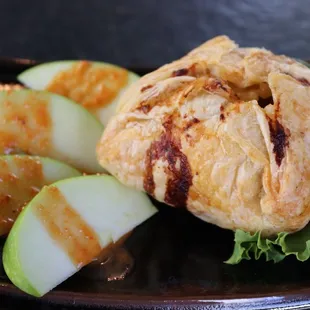 Bacon Apple Turnover

Bacon, White Cheddar, Apple, Onion Turnover / with sliced apple, roasted red pepper vinaigrette