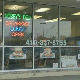 a breakfast and lunch open sign