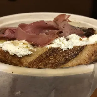 a sandwich with cream and ham