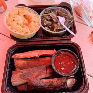 2 bone rib plate Mac n cheese collar greens. This rite here is the business very good food.