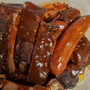 My 3 meat bbq plate.. Big enough to feed 2-3 people. The spicy BBQ sauce was VERY good.