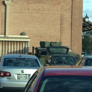 Army HumVee in parking lot following Isaac.