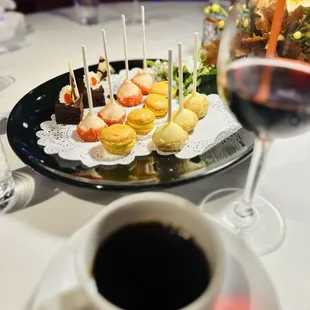 a plate of appetizers and a cup of coffee