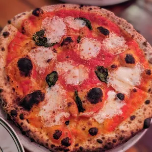 a pizza on a plate on a table