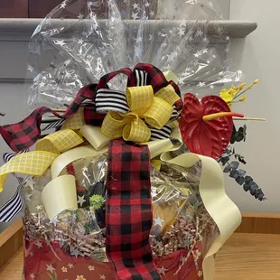Honolulu basket with red and yellow ribbons as requested.