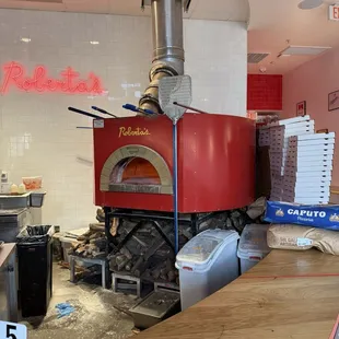 The oven that makes their delicious pizzas.