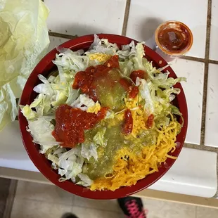 The fantastic chicken burrito bowl with the hot sauce added!