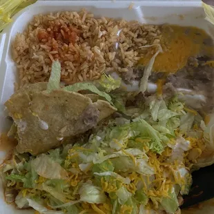 Cheese enchilada and shredded beef taco combo