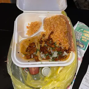 All my rice is with my beans with these baby tacos. I couldn't get all three regular tacos meats like the sign advertised