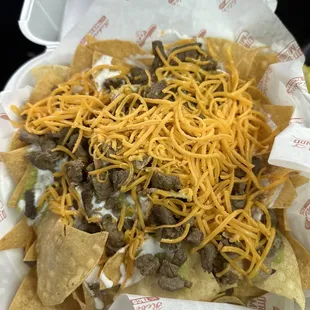 Queso todo frio y nachos mi cae gordo como uno paga y ni le echar ganas ala comida