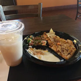 Chicken and cheese tortilla, side of sour cream, and pico de gallo with a small horchata.