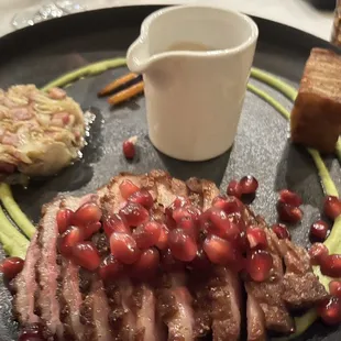 PETTO DI ANATRA* Roasted Mulard duck breast, cabbage, pancetta, pea puree, potato pavé, carrots