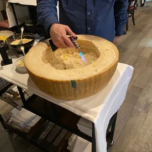 Fettuccine alla parmesana , with a super-rich Parmesan and olive oil sauce made table-side