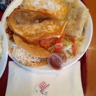 Roberto&apos;s Special Plate. Tamale filled with cheese and bits of green chile. Relleno had a thick batter over the top with eggy flavor.