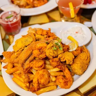 a plate of fried shrimp and fries