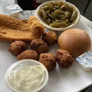 1 Catfish plate with hush puppies and green beans.