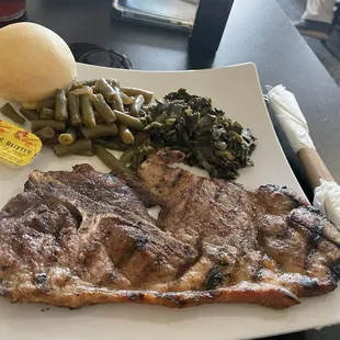 Grilled pork steak with collards and green beans
