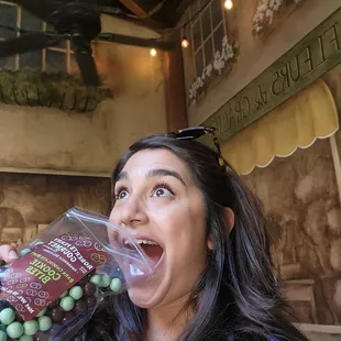 a woman eating grapes