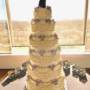 Unique customized 6 tier wedding cake. 

Call us/email us to get started on planning your perfect cake with us.