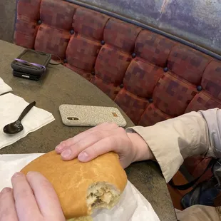 a person eating a sandwich