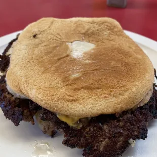 Double cheeseburger turned over to see the fantastic crust on the meat and onions