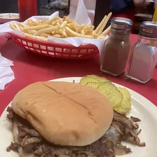 a beef sandwich and french fries